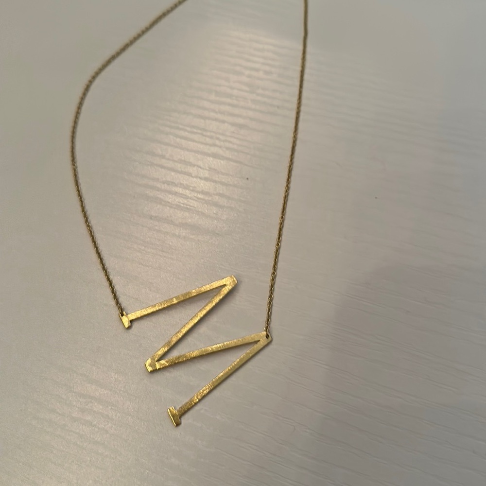 Gold Anthropologie M necklace